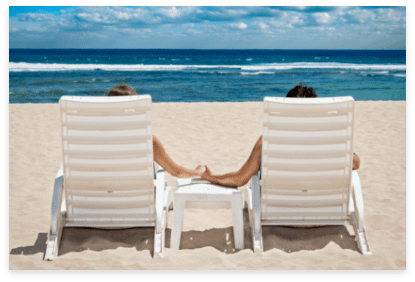 Depositphotos Becah chairs couple holding hands
